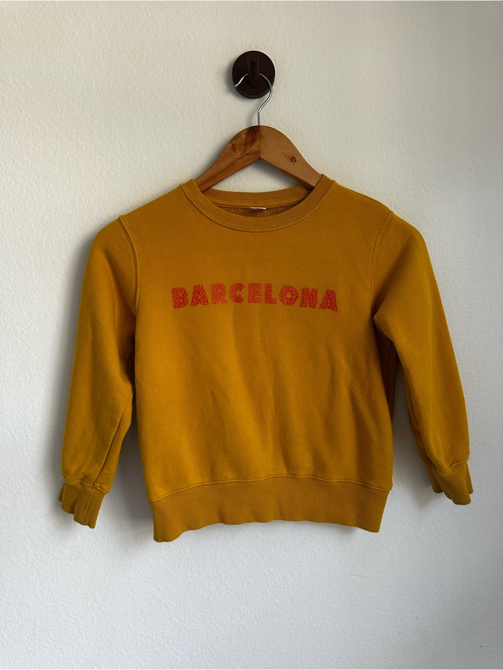 Uniqlo Kids Mustard Yellow Crewneck Sweater with Red 'Barcelona' Logo